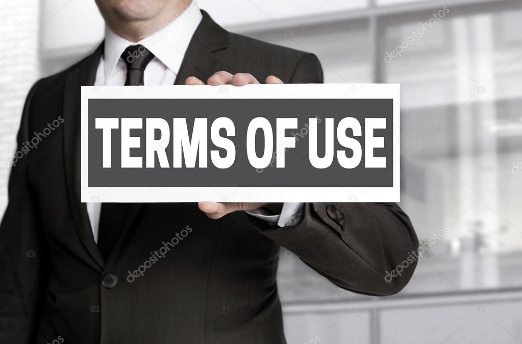 Terms of Use sign is held by businessman
