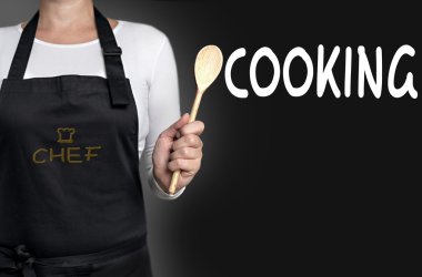 tahta kaşık arka planda tutan yemek pişirme