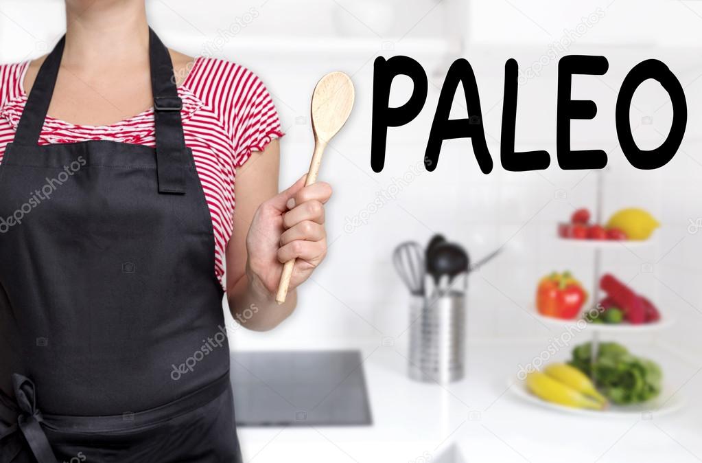 paleo cook holding wooden spoon background concept