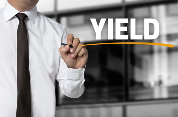 Yield written by businessman background concept — Stock Photo, Image