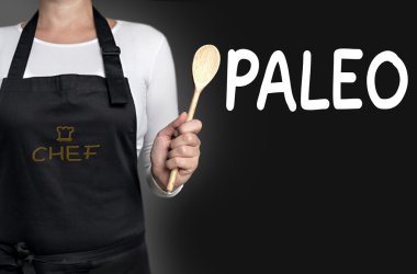 paleo cook holding wooden spoon background concept clipart