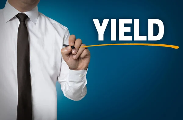 Yield written by businessman background concept — Stock Photo, Image