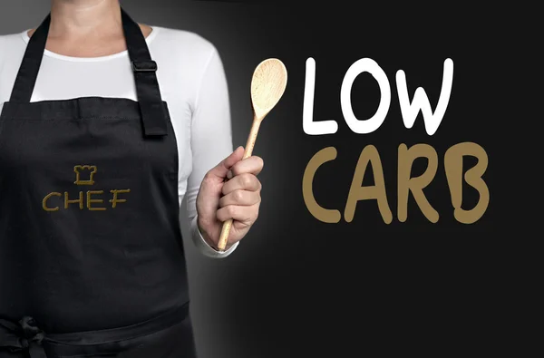Low carb cook holding wooden spoon background concept — Stock Photo, Image
