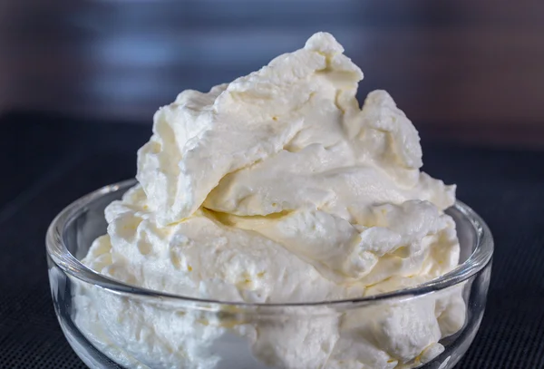 Cream in a glass bowl Macro shot — Stock Photo, Image