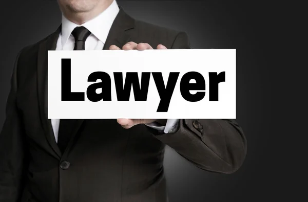 Адвокатський знак тримається концепцією бізнесмена — стокове фото
