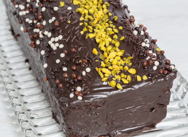 Chocolate cake with pistachios detail macro — Stock Photo, Image