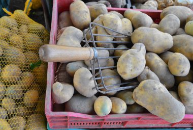 potatoes raw vegetables food for sale at farmers market. Backgro clipart