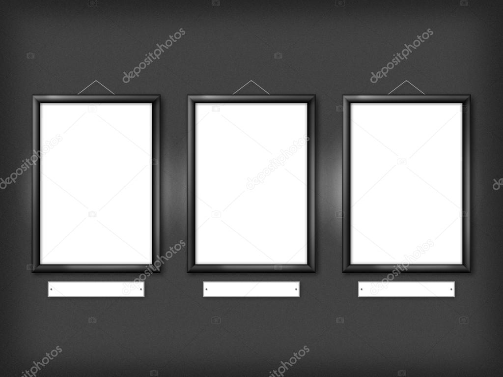 Three empty frames on a wall 