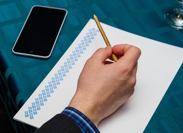 Close up of male hands doing paperwork with pencil — Stock Photo, Image