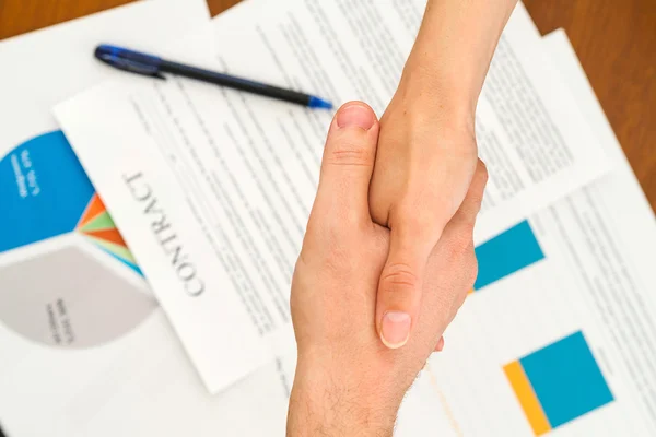 Image of business partners handshaking over business contract — Stock Photo, Image