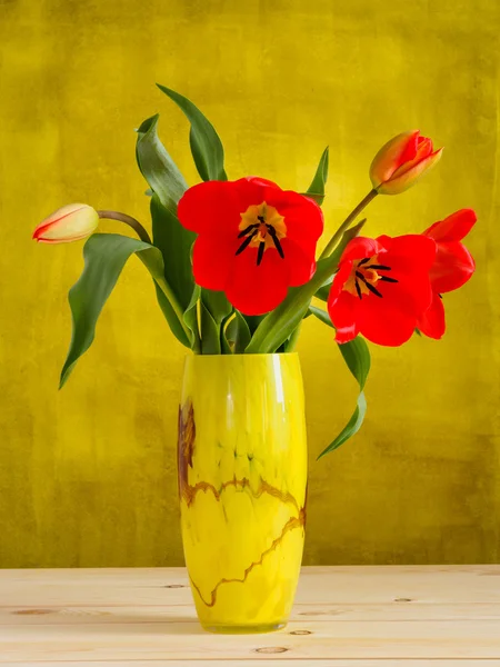 Red tulips in a vase — Stock Photo, Image