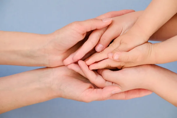 People, charity, family and care concept - close up of woman hands holding girl and boy hands — Stock Photo, Image