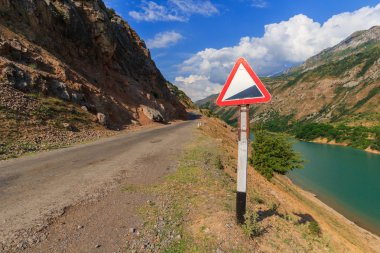 Warning road sign. The landscape of Uzbekistan.