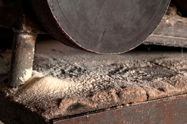 Wooden sawdust and electric grinding machine. — Stock Image Wooden sawdust and electric grinding machine. Royalty Free Stock Photos