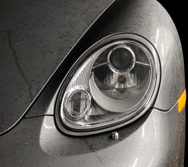 Wet car headlights. — Stock Photo, Image