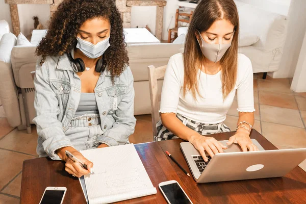 Two Young Mixed Race Beautiful Women Working Home Sitting Wooden — Stock Photo, Image