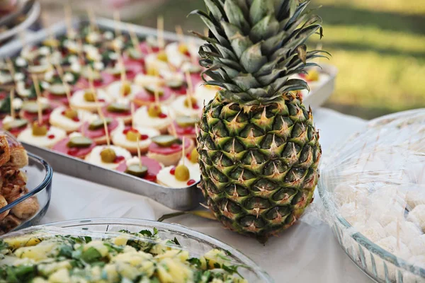 pineapple and snacks at a summer party