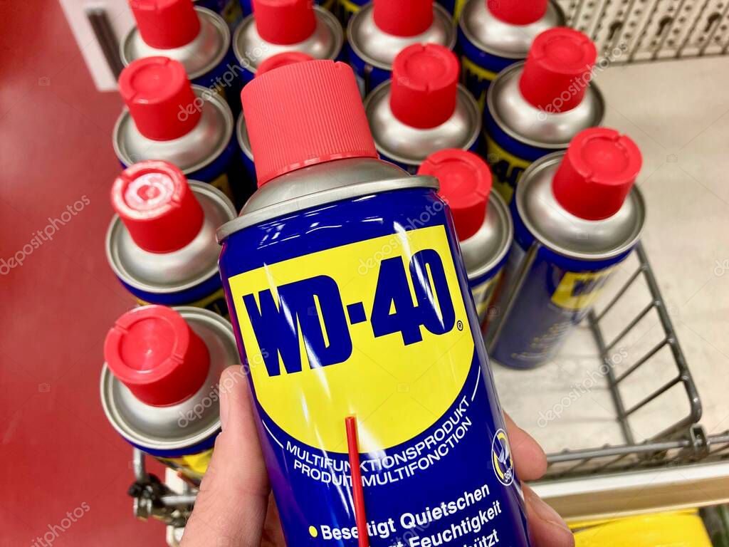Manno, Switzerland - 3rd March 2021 : WD-40 lubricant products displayed on a store in Switzerland. WD-40 is an American brand and the trademark name of a water-displacing spray multi-use product