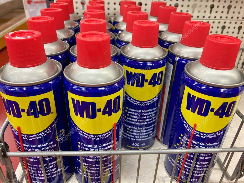 Manno, Switzerland - 3rd March 2021 : WD-40 lubricant products displayed on a store in Switzerland. WD-40 is an American brand and the trademark name of a water-displacing spray multi-use product