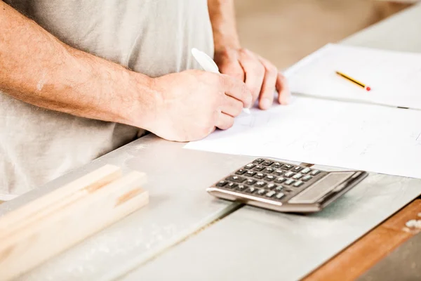Woodworker planning calculating and measuring — Stock Photo, Image