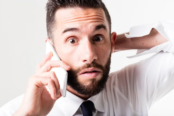 Surprised businessman on the phone — Stock Photo, Image