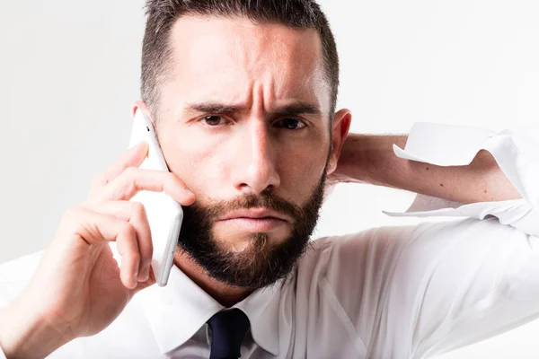 Businessman on his mobile discussing Stock Picture