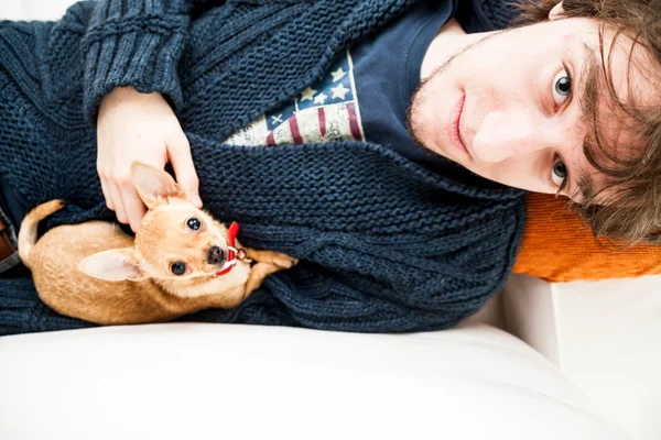 Portrait of a young man with a Chihuahua — Stock Photo, Image