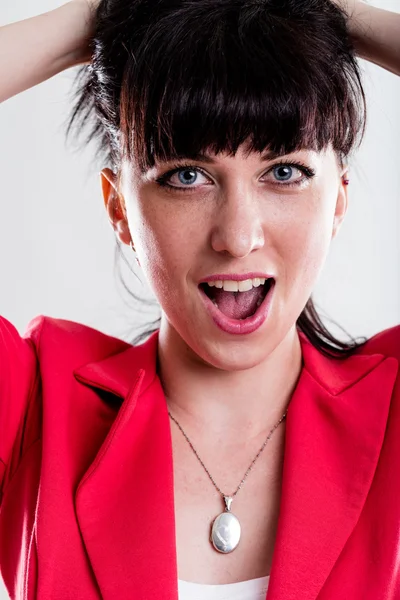 Singing or yelling woman with hands in hair — Stock Photo, Image