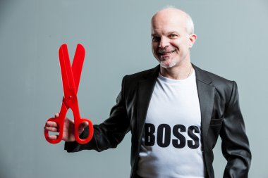 Smiling senior businessman wearing a Boss t-shirt clipart