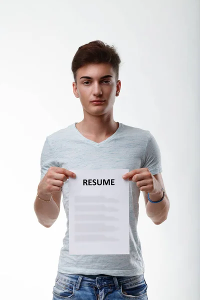 Young Man Holding Blank Document Title Resume Front His Chest — Stock Photo, Image