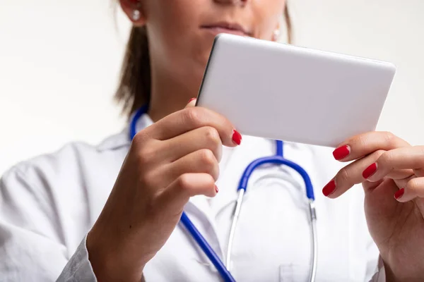 Female Doctor Nurse Reading Message Her Mobile Phone Watching Media — Photo