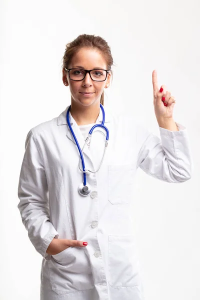 Relaxed Young Female Doctor Nurse Lab Coat Stethoscope Standing Pointing — Stock fotografie