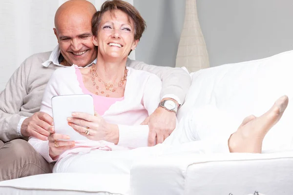 Attractive Vivacious Middle Aged Couple Relaxing Home Couch Close Embrace — Stock Photo, Image