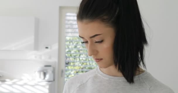 Close-up shot of girl's face with cellphone — Stock Video