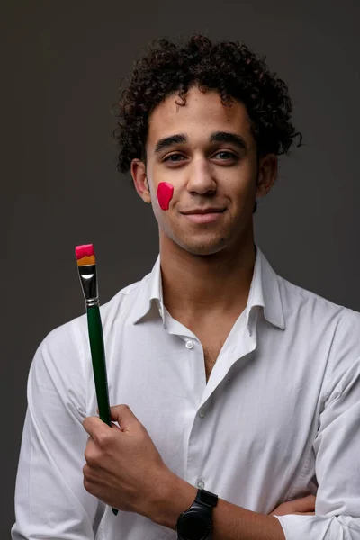 Smiling Confident Young Man Streak Red Paint Cheek Smiling Confidently — Stock Photo, Image