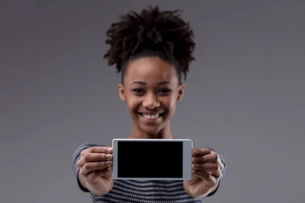 Happy Excited Young Black Woman Holding Out Her Mobile Phone — Stock Photo, Image