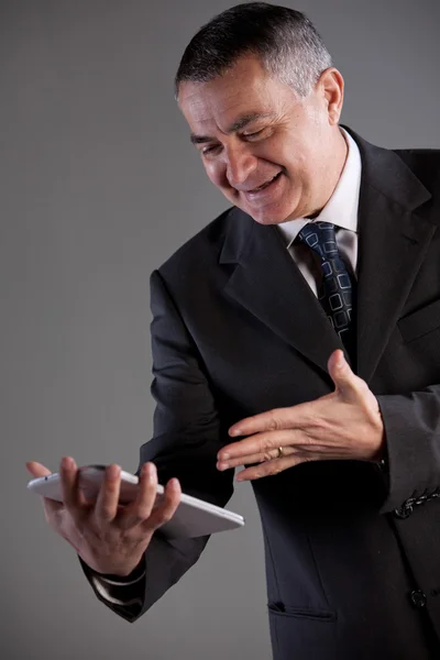 Senoir man using successfully a tablet — Stock Photo, Image