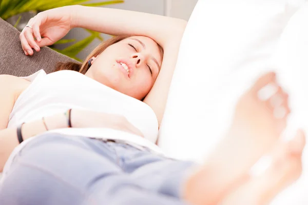 Girl dreaming and sleeping on her couch — Stock Photo, Image