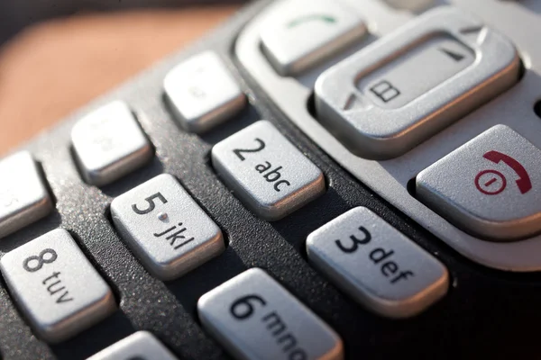 Closeup of a telephone keypad in direct sunlight — Stock Photo, Image
