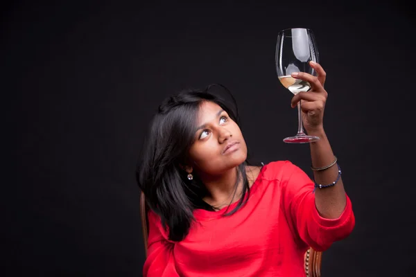 Indian girl with a glass of white wine — Stock Photo, Image