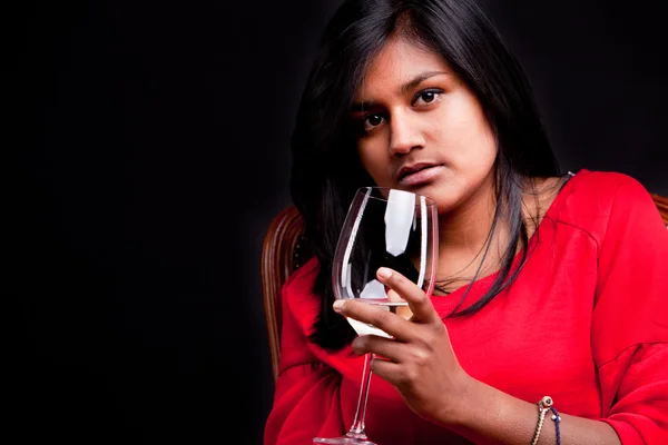 Indian girl with a glass of white wine — Stock Photo, Image