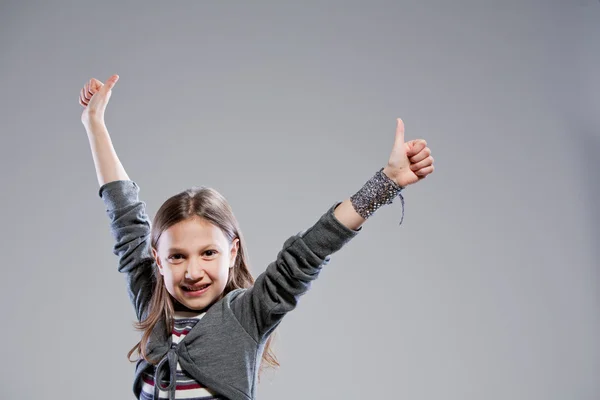 Thumbs up everybody says the girl — Stock Photo, Image