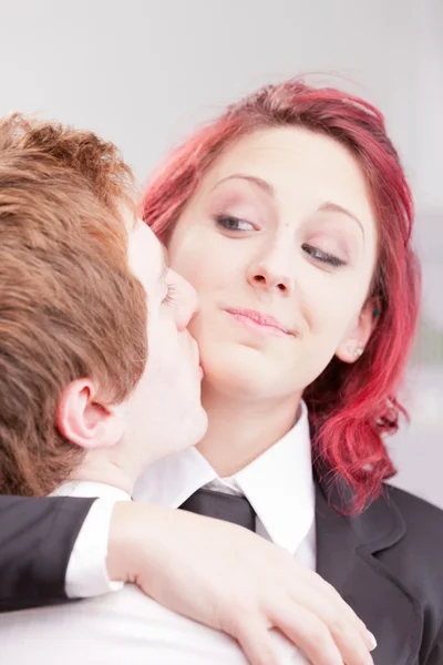 Red headed clerks loving each other — Stock Photo, Image