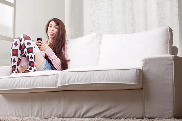 Rascal girl showing her tongue stuck out — Stock Photo, Image