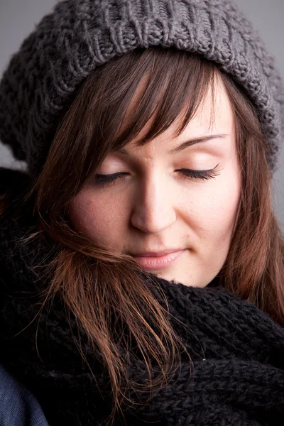 Closed eyes girl with hat and scarf — Stock Photo, Image