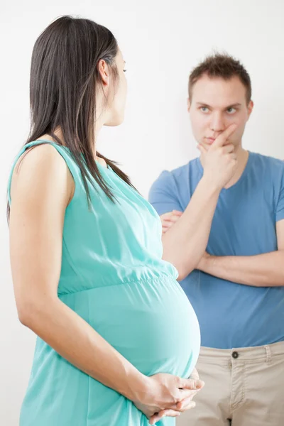 Pregnant woman with doubtful husband — Stock Photo, Image