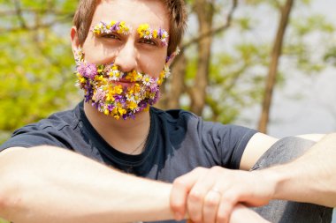 hipster self-confident man flowers covered face clipart
