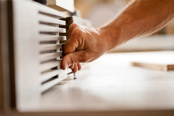 Hand working with a wood shaper — Stock Photo, Image