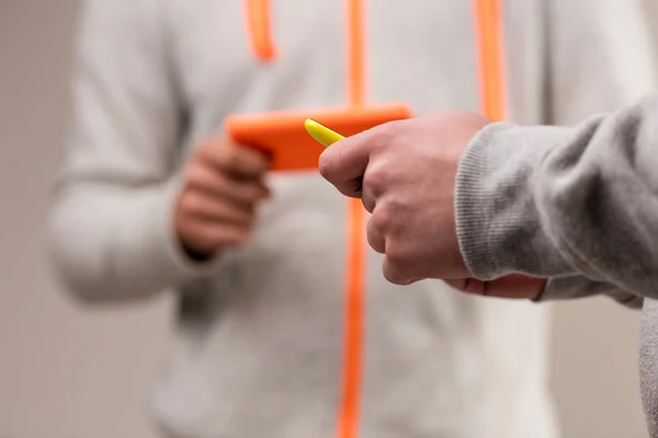 Hands using smartphones on their own — ストック写真