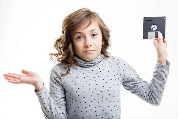 Floppy disk is unknown for this little girl — Stock Photo, Image